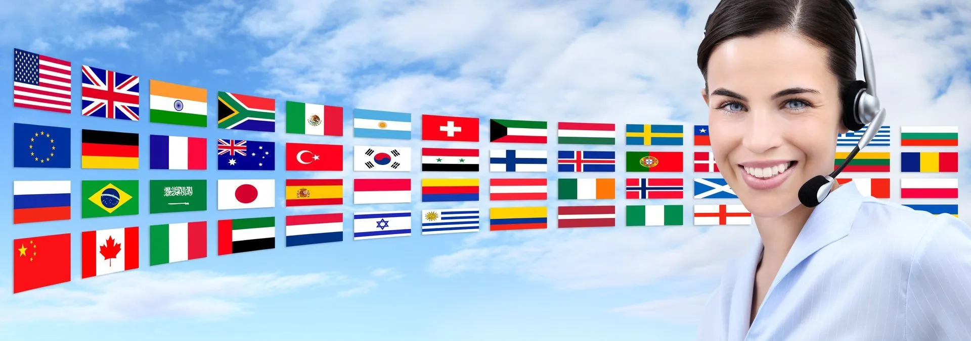 Flags from around the world beside a customer service professional helping organizations