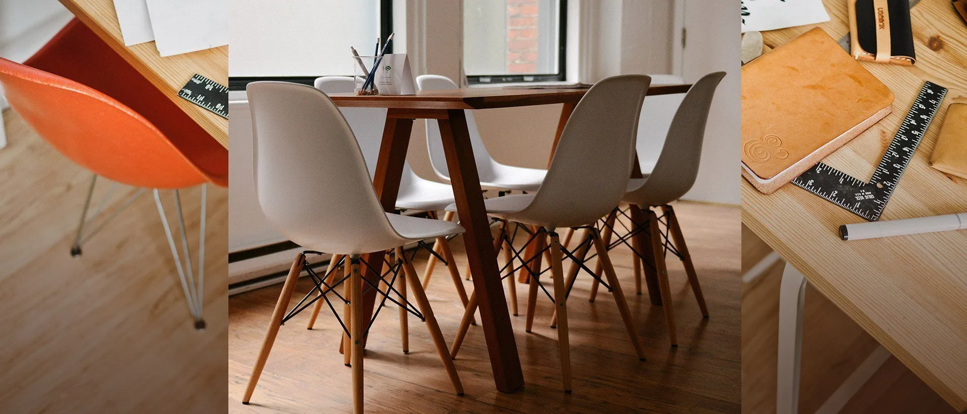 Bright studio with orange chairs and a table for discussing a service project